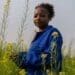 6 September 2018: 27-year-old Dineo Boshomane standing in a field of some of the Chinese spinach which she grows on her one-hectare farm in Northern Farm, Diepsloot. | Photo: Ihsaan Haffejee, New Frame.