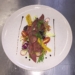 Chef Sibu Nyembe's braised ox tongue salad on a bed of summer salad.