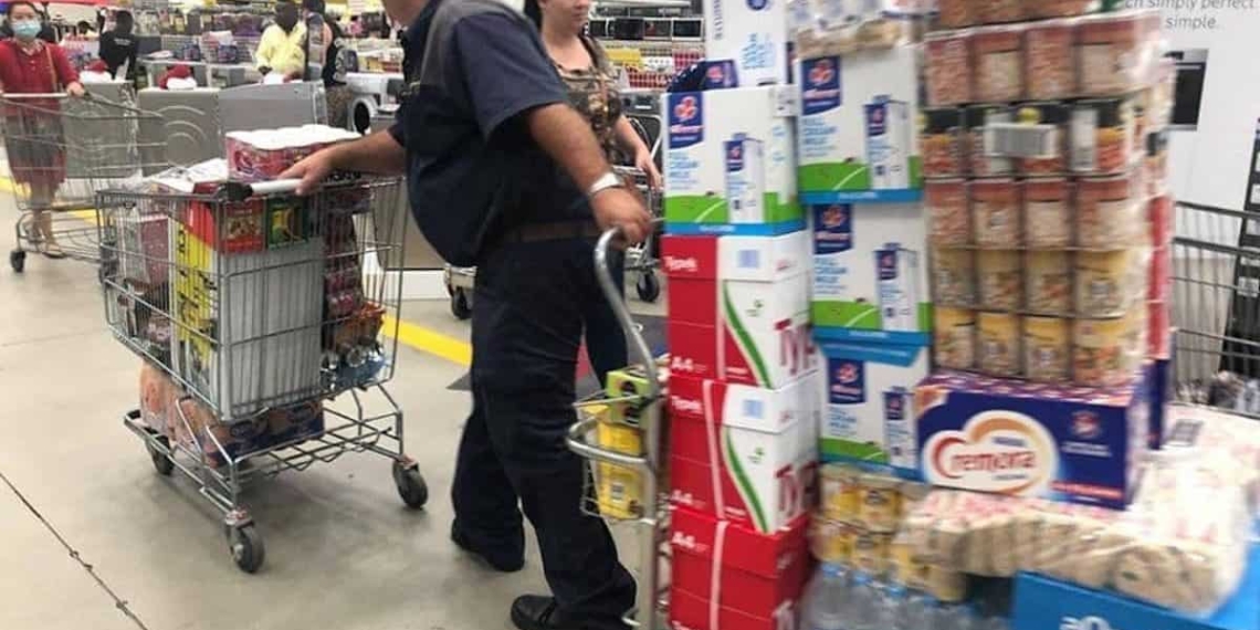 Shoppers are scrambling for groceries as coronavirus numbers rise in South Africa.