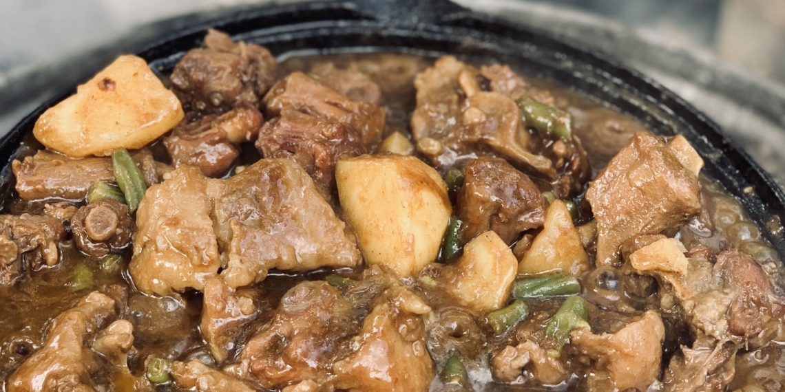 Oxtail potjie on the fire made by Ricky Schroeder.