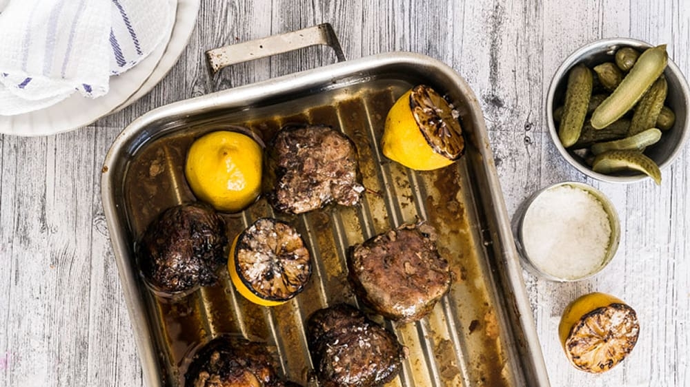 'Huiskok' Errieda du Toit makes the age old South African fireside favourite, skilpadjies. Photo: Ian du Toit