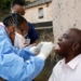 A health worker wearing a protective suit takes a swab from a resident during earlier door-to-door testing in an attempt to contain the coronavirus disease outbreak, in Umlazi township near Durban. Photo: AFP