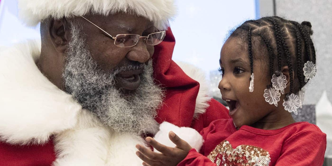 Santa Clause brings Christmas cheer to a young Food For Mzansi reader. Photo: Supplied