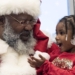 Santa Clause brings Christmas cheer to a young Food For Mzansi reader. Photo: Supplied
