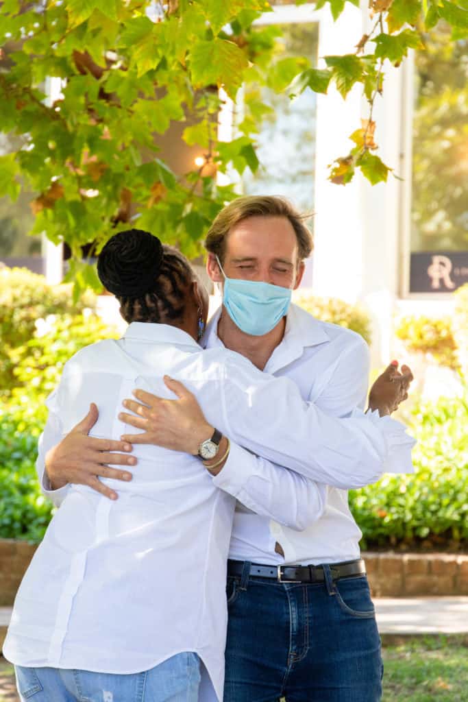 Dr Luke Metelerkamp, a post-doctoral fellow at the Environmental Learning and Research Centre at Rhodes University, greets Busisiwe Mngaxela, an Eastern Cape farmer and Sinelizwi candidate. Photo: Food For Mzansi