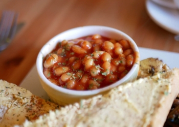 Food safety: Consumers are advised to return tins with specific bath numbers on them following defective canning with KOO and Hugo's products. Photo: Supplied/Food For Mzansi