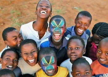 Mandela Day: An earlier picture of the brothers Thabana and Tsholofelo Matlhonoko with their faces painted in the South African flag, posing with their friends. Photo: Marc Aspland/The Times