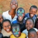 Mandela Day: An earlier picture of the brothers Thabana and Tsholofelo Matlhonoko with their faces painted in the South African flag, posing with their friends. Photo: Marc Aspland/The Times