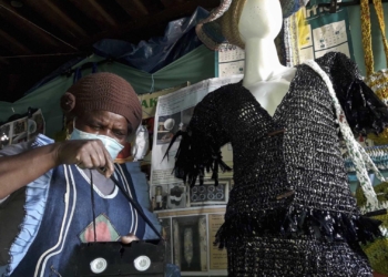 Recycling: Thenjiwe Jacobs, founder of the Noziqamo recycling project in Motherwell, Gqeberha, with an outfit she made using old VCR tapes. Photo: Photographs by Sibongile Portia Jonas