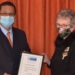 Women's Day: Western Cape agriculture minister Dr Ivan Meyer hands over a certificate of appreciate to Estelle du Plessis, the West Coast circle president of the Vrouelandbouvereniging (VLV). Photo: Supplied/Food For Mzansi