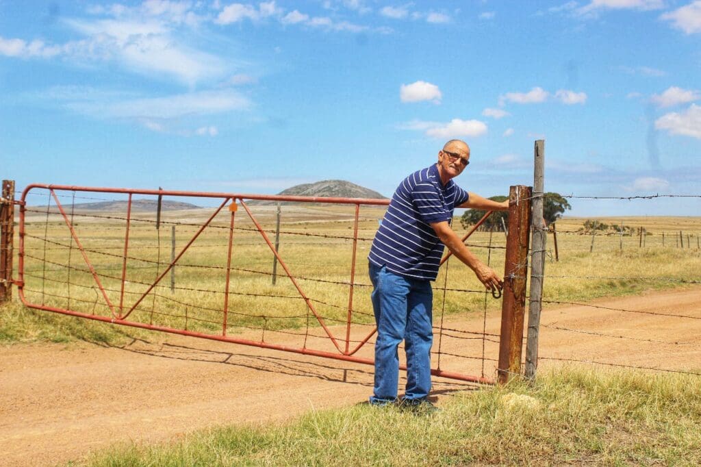 Ivan Cloete opens a gate on his Colenso farm in Darling in the Western Cape. Photo: Duncan Masiwa/Food For Mzansi