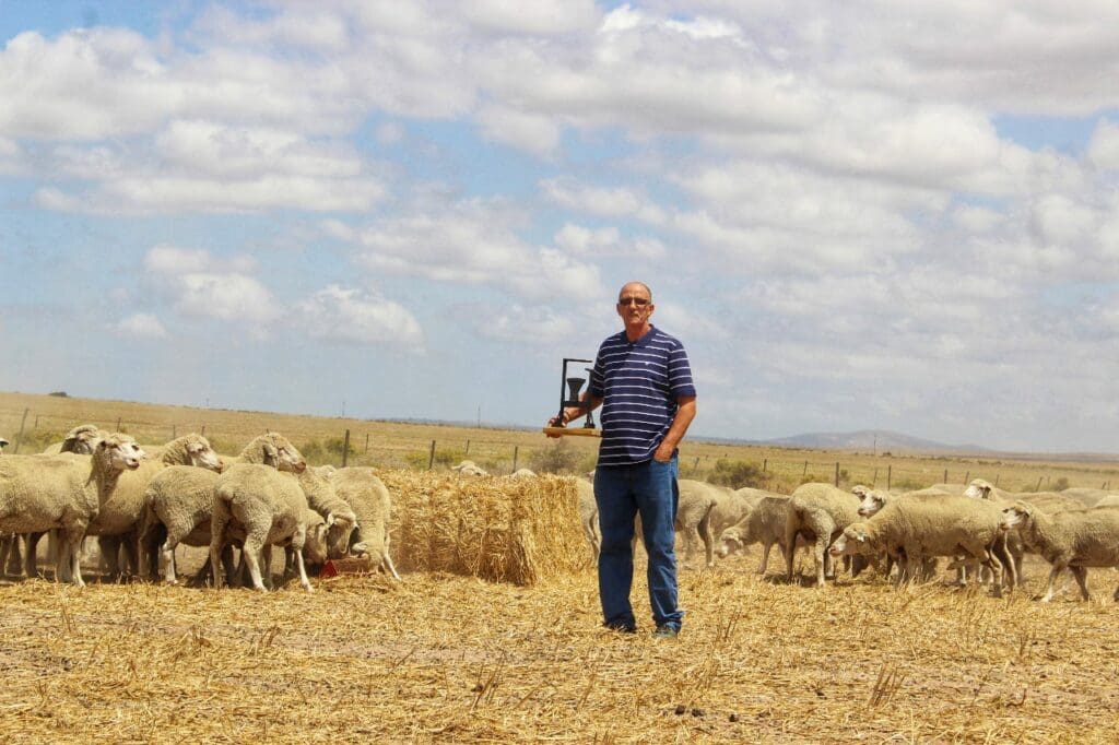 Ivan Cloete with a recent BKB trophy he won for producing quality sheep. Photo: Duncan Masiwa/Food For Mzansi