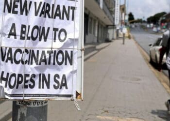 A man walks past newspaper billboards during the coronavirus disease (COVID-19) outbreak in Johannesburg. Photo: Reuters/Sumaya Hisham