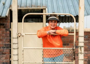 Stinie's farm Gretna Green rears livestock, including sheep, cows, donkeys and horses. Here, she can be seen standing before the area where her lambs are weaned. Photo: Supplied/Food For Mzansi