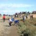 Citrus protest: Residents of Kirkwood gather on the gravel road near Moses Mabhida township. Protesters have been interdicted from entering several farms in the Sundays River Valley. Photo: Bonile Bam/New Frame