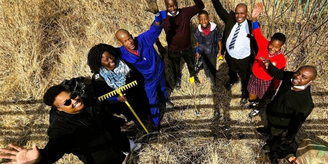 A group of students, groundsmen, teachers and BLUU Car Rental volunteers celebrate their handywork of planting trees. Photo: Supplied/Food For Mzansi