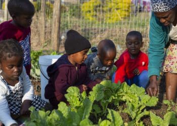 Some of the children with the ECD practitioner Yolanda Shabalala. Zero2Five Trust promotes holistic Early Childhood Development in formerly disadvantaged areas by improving learners’ health and education outcomes with nutrition and education programmes. Photo: Supplied/Zero2Five Trust