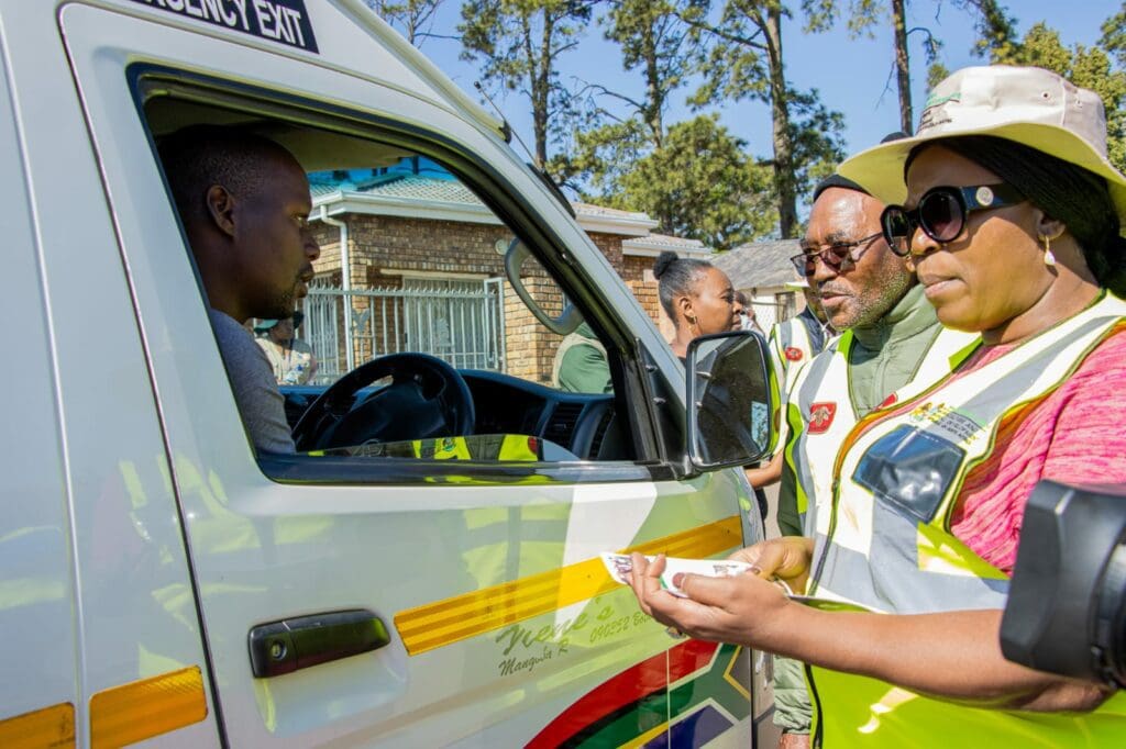 The MEC not only led a vaccination drive but also handed out information pamphlets at a roadblock. Photo: Supplied/Food For Mzansi