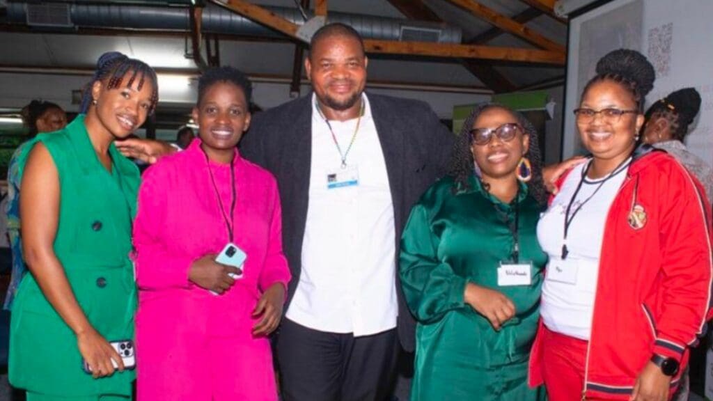Representatives from the Department of Agriculture Land Reform and Rural Development (left) Sithabisile Ngiba-Cebekhulu and Mutondi Rambau, and (right) Noluthando Netnou-Nkoana and Mpolokeng Mokoena, celebrate with agroecology farmer Sipho Zungu (centre) at the launch of Biowatch’s new book Stories of Resilience Built Through Agroecology. Photo: Supplied/Food For Mzansi