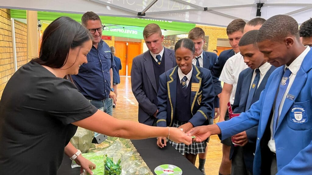 Naturesmart meets the next generation of agriculturists. The company’s marketing manager, Zaan van der Merwe, engages with eager learners at the AgriCareers event in Clanwilliam, inspiring a passion for sustainable agriculture. Photo: Ivor Price/Food For Mzansi