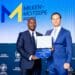 Tendai Chitapi accepting the award after an announcement that Kuronga had won the Milken-Motsepe Prize in Agritech for the Most Creative Use of 4IR. They also walked away with a cash prize of USD100 000. Photo: Koronga