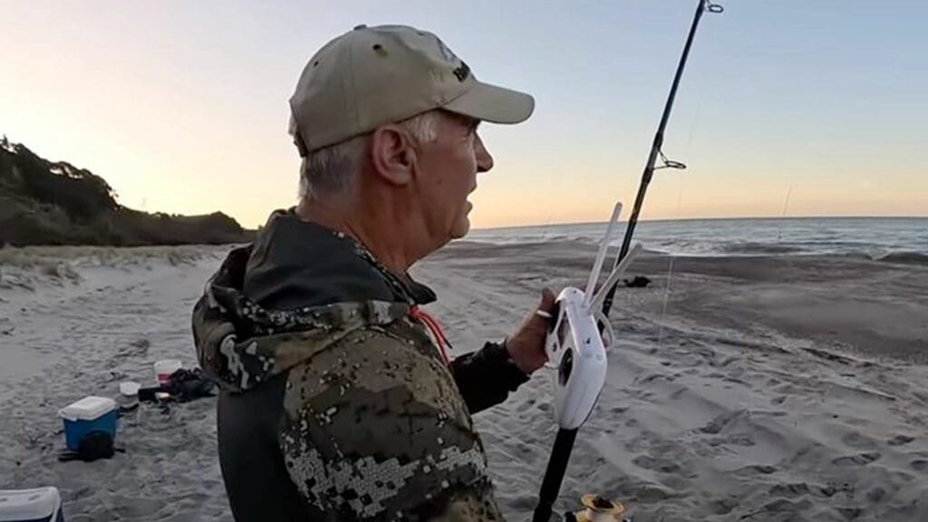 A screengrab of a drone fisher in New Zealand setting up his gear. (Screengrab: YouTube)