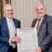 Pieter du Toit’s visionary leadership drives Dutoit Agri’s global expansion and community impact, earning him the 2024 OSH Reinecke Frontrunner Award, presented by Hortgro’s Anton Rabe. Photo: Supplied/Food For Mzansi