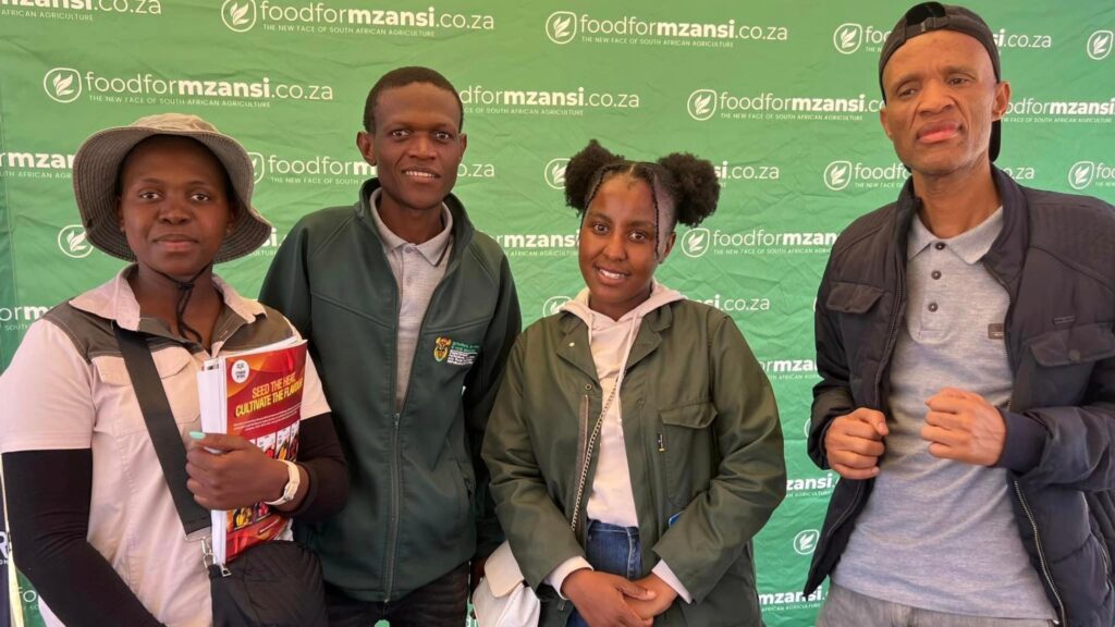 Khaukhanani Ralishugu and Tlou Kabe from the department of agriculture with farmers after sharing valuable insights on livestock pests and marketing information systems. Photo: Ivor Price/Food For Mzansi