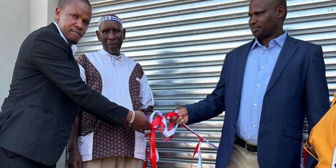 AB Xuma municipality councillor Sandiso Ngxangu and chief Jongisiswe Gwarhubana cut the ribbon to mark the handover of a new shearing shed built by the Eastern Cape department of rural development and agrarian reform, while Mgwalana Woolgrowers Association chairperson Sithembele Kutu looks on. Photo: Supplied/Anathi Zitshu/DRDAR