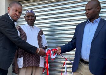 AB Xuma municipality councillor Sandiso Ngxangu and chief Jongisiswe Gwarhubana cut the ribbon to mark the handover of a new shearing shed built by the Eastern Cape department of rural development and agrarian reform, while Mgwalana Woolgrowers Association chairperson Sithembele Kutu looks on. Photo: Supplied/Anathi Zitshu/DRDAR