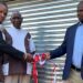 AB Xuma municipality councillor Sandiso Ngxangu and chief Jongisiswe Gwarhubana cut the ribbon to mark the handover of a new shearing shed built by the Eastern Cape department of rural development and agrarian reform, while Mgwalana Woolgrowers Association chairperson Sithembele Kutu looks on. Photo: Supplied/Anathi Zitshu/DRDAR