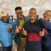 Jason Baartman energised the crowd with his hip-hop performance at Food For Mzansi’s special Nampo Cape session for agricultural workers. He is joined by the publication’s assistant editor Duncan Masiwa and enthusiastic workers. Photo: Adéle Changuion/Food For Mzansi