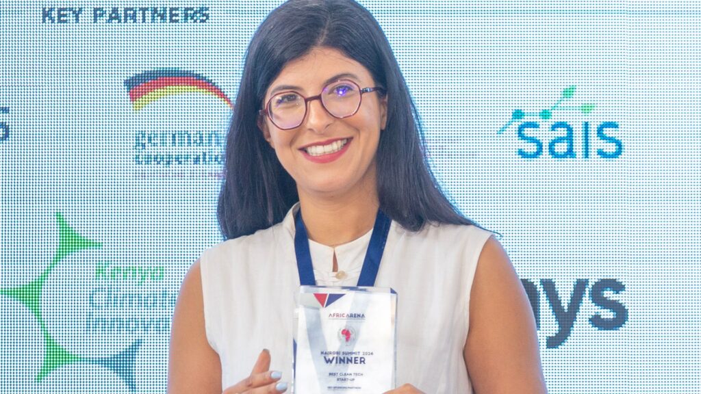 Sabrine Chennaoui, co-founder and CEO of MonSapo, proudly accepts the Best Clean Tech Startup Award at the AfricArena Nairobi Summit, highlighting their leadership in digital innovation for environmental sustainability. Photo: Supplied/Ian Njoroge/EsoundsGroup