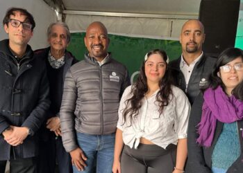 Land Bank CEO Themba Rikhotso with Kauthar (29) and Zaid Noor (35), along with their family, in Montagu, Western Cape. Kauthar and Zaid, Land Bank clients, successfully acquired their 84.34 ha peach farm with support from the blended finance scheme. The family expressed their gratitude to Land Bank for the assistance. Photo: Ivor Price/Food For Mzansi