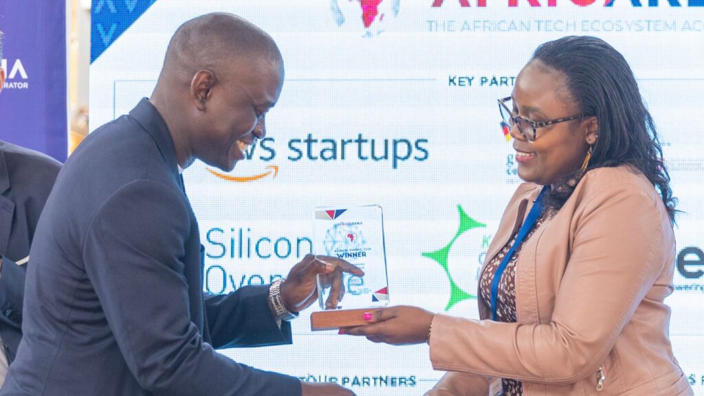 Tichaa Johnson Penn, founder and CEO of Ecolinks, receives the Most Promising Entrepreneur Award at the AfricArena Nairobi Summit, recognising their work in integrating technology with environmental solutions. Photo: Supplied/Ian Njoroge/EsoundsGroup