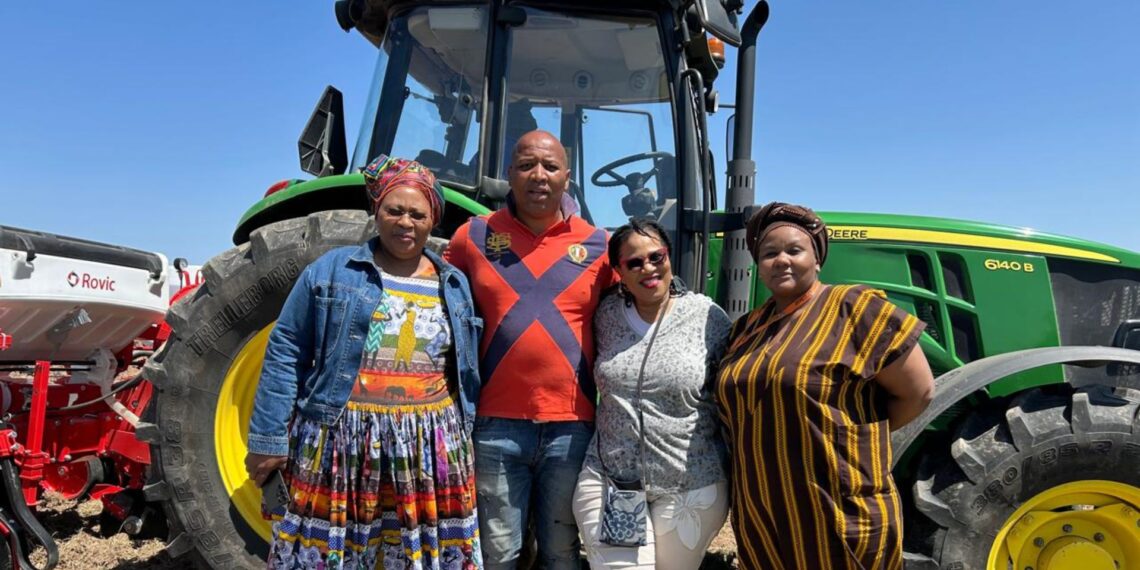 Eastern Cape member of parliament Nozibele Nyalambisa, beneficiary Mawande Jama, department of rural development and agrarian reform chief director for agricultural producer support and development Nandi Ndudane, and strategic partner Luleka Mbethe stand proudly in front of a tractor during the launch of the cropping programme in Dutywa. Photo: Supplied/Food For Mzansi