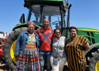 Eastern Cape member of parliament Nozibele Nyalambisa, beneficiary Mawande Jama, department of rural development and agrarian reform chief director for agricultural producer support and development Nandi Ndudane, and strategic partner Luleka Mbethe stand proudly in front of a tractor during the launch of the cropping programme in Dutywa. Photo: Supplied/Food For Mzansi