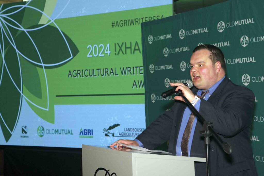 Peter Pentz, chairperson of !Xhariep Agricultural Writers SA, delivers an inspiring address at the regional awards ceremony, stressing the importance of collaboration and unity in the agricultural sector. Photo: Supplied/AWSA