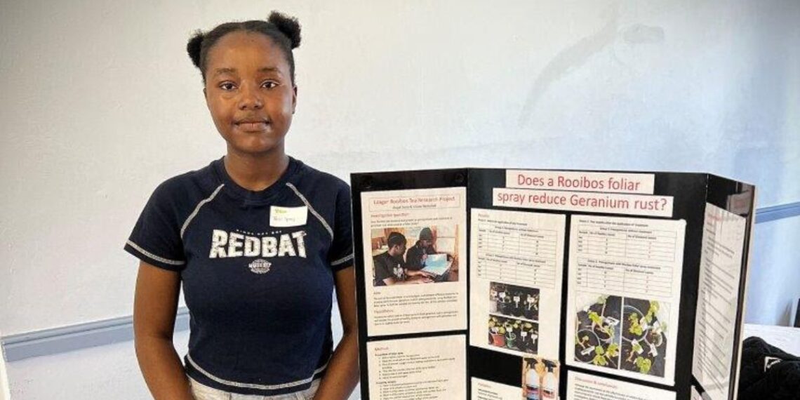 Vision Nemulodi from Northcliff House College proudly accepts first place in the Science Research Competition for her innovative project on recycling Laager Rooibos tea. Photo: Supplied/Food For Mzansi