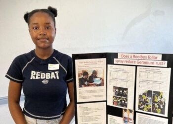 Vision Nemulodi from Northcliff House College proudly accepts first place in the Science Research Competition for her innovative project on recycling Laager Rooibos tea. Photo: Supplied/Food For Mzansi