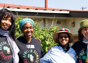 From left to right: Samantha Muller, Mitchelle Mhaka, Washiela Isaacs, and Stella Hertantyo at Cape Town Climate Week, visiting the Oppieyaart in Elsies River.
Photo: The Dollie House