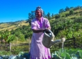 What started as a small backyard garden has become a source of food security and financial independence for Zandile Shinga. She waters her cabbages at her plot in ePlazini, where Thanda is helping families build resilience through regenerative gardening. Photo: Supplied/Food For Mzansi