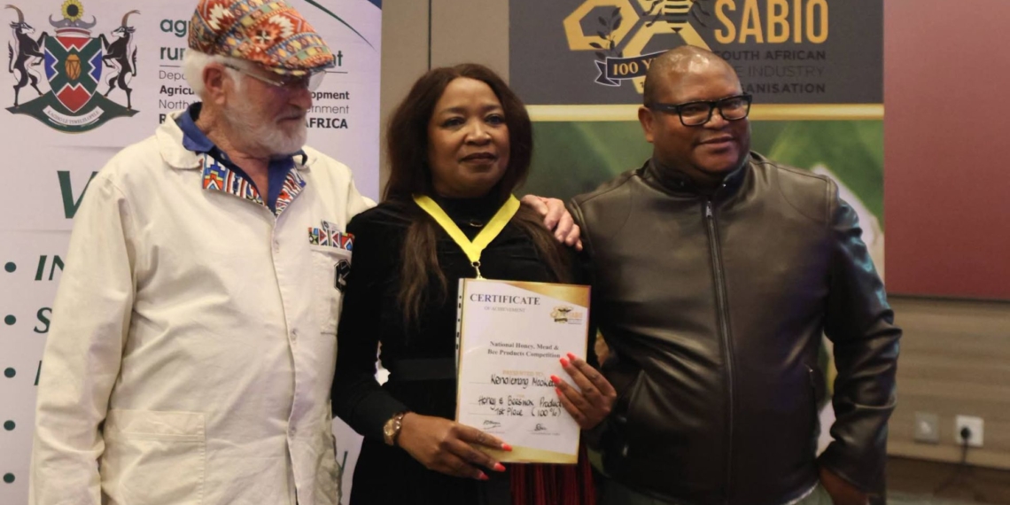 North West beekeeper Kenalemang Mooketsi (middle) was among the province’s beekeepers recognised at the National Bee Conference, where she received an award for her contribution to the beekeeping sector. Photo: Supplied/Food For Mzansi